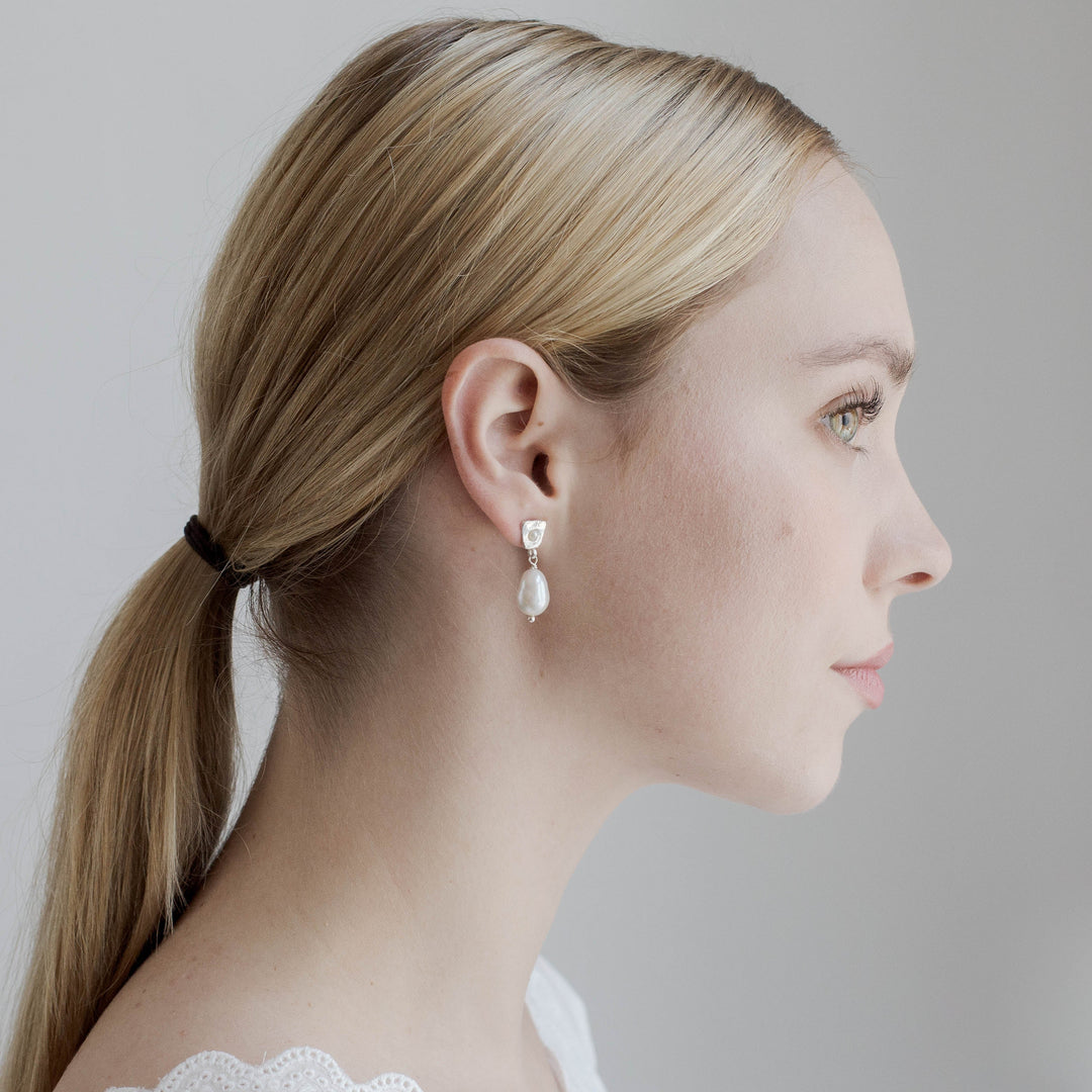 FALKEVIKA // Subtle silver earrings with delicate baroque pearl