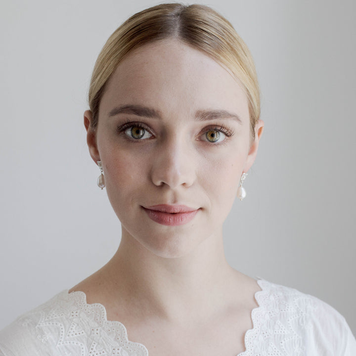 FALKEVIKA // Subtle silver earrings with delicate baroque pearl
